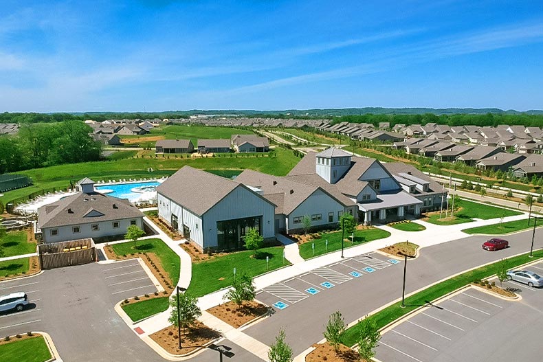 Aerial view of an amenity center and multiple houses in Del Webb Southern Springs, located in Spring Hill, Tennessee