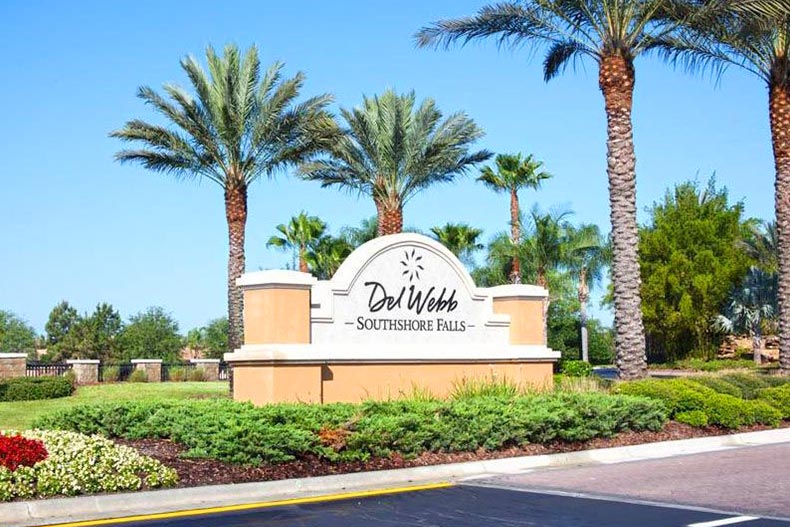 Palm trees surrounding the community sign for Southshore Falls in Apollo Beach, Florida