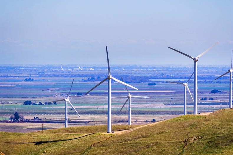 Wind turbines on the hills of east San Francisco bay with Stockton valley in the background