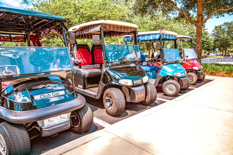Photo of four golf carts parked in a row at Stone Creek in Ocala, Florida