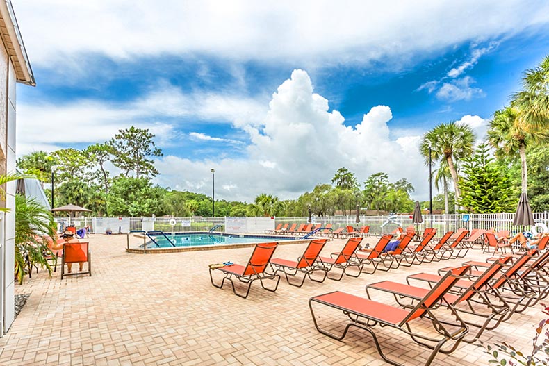 The outdoor pool and patio at Summertree in New Port Richey, Florida