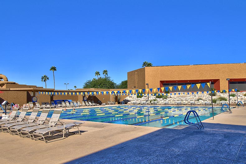 Lounge chairs surrounding the outdoor pool at Sun City in Sun City, Arizona