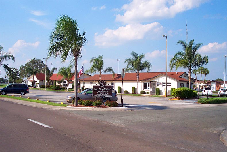 Palm trees surrounding a community building at Sun City Center in Florida