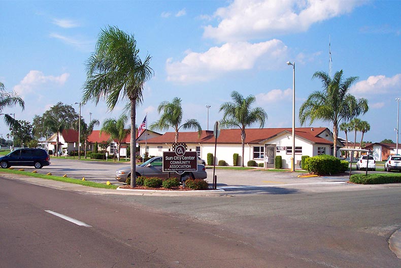 Palm trees surrounding a community building at Sun City Center in Florida