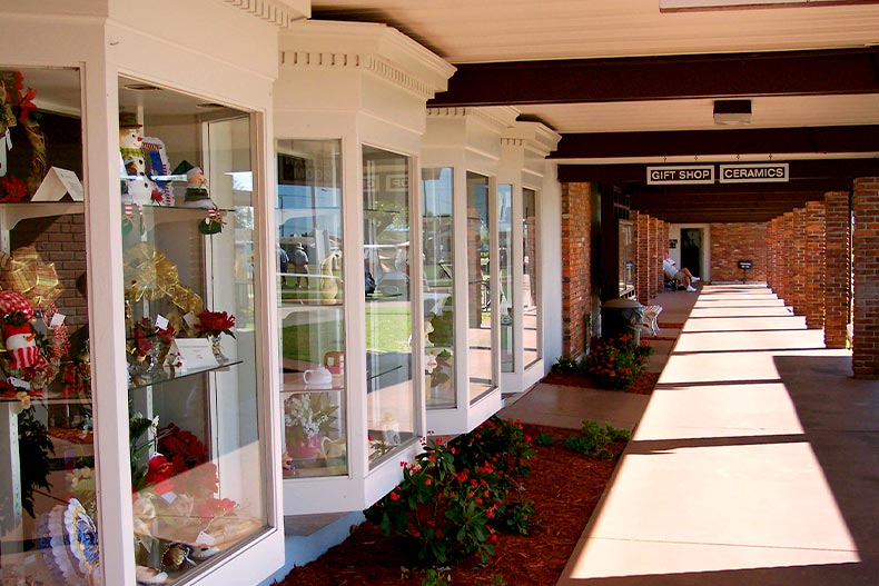 Exterior view of the ceramics clubhouse in Sun City Center with four windows showcasing Christmas decorations