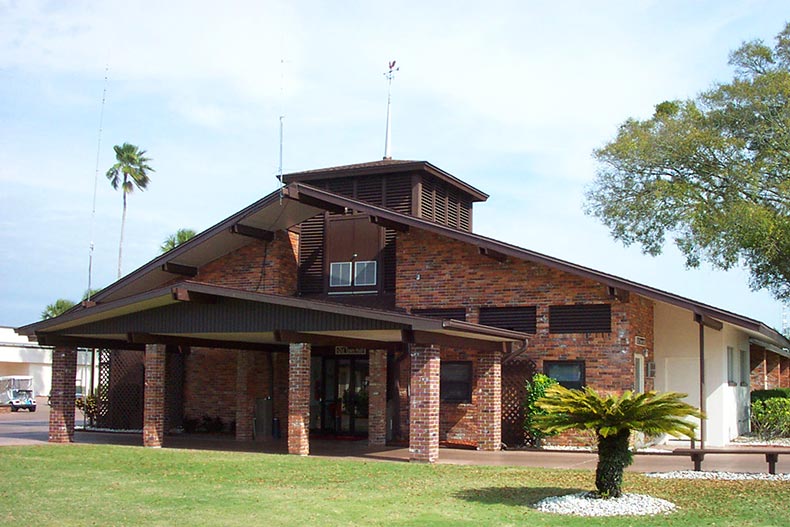 Exterior view of a brick clubhouse in Sun City Center, Florida