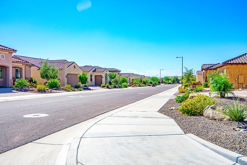 A residential street on a sunny day at Sun City Festival in Buckeye, Arizona