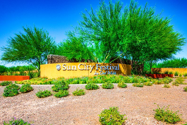 Greenery surrounding the community sign at Sun City Festival in Buckeye, Arizona