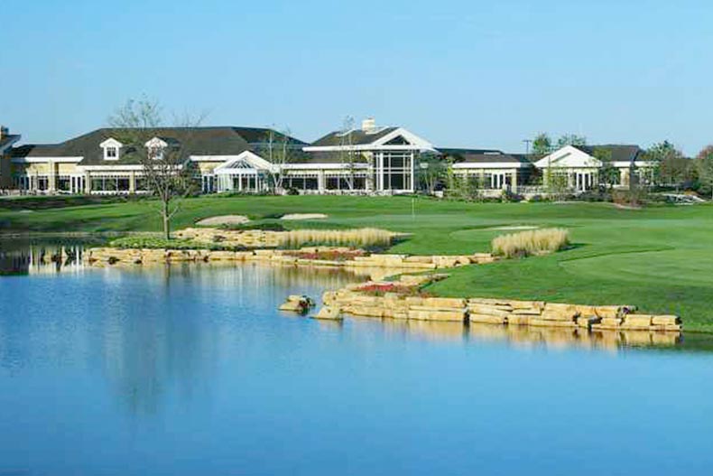 View across the pond of the clubhouse at Sun City Huntley in Huntley, Illinois