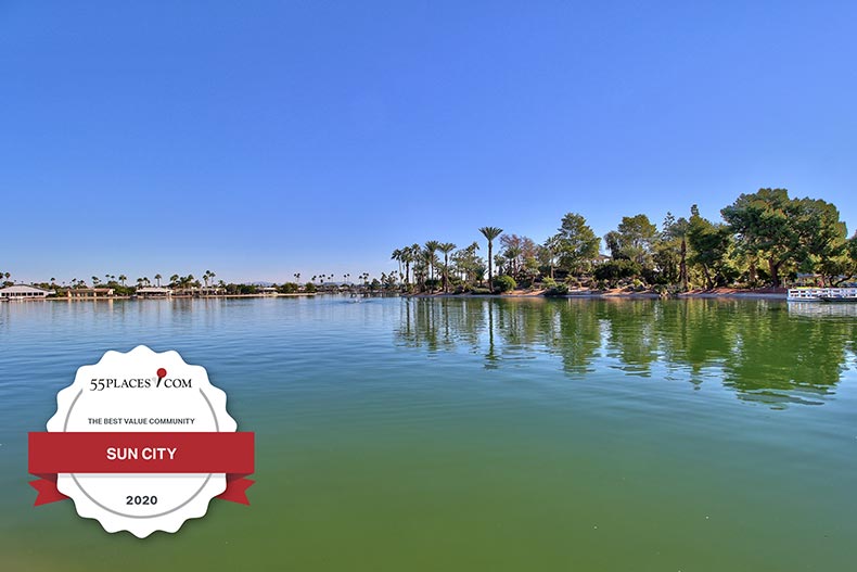 "Best Value Active Adult Communities of 2020" badge over trees surrounding a picturesque pond at Sun City in Arizona