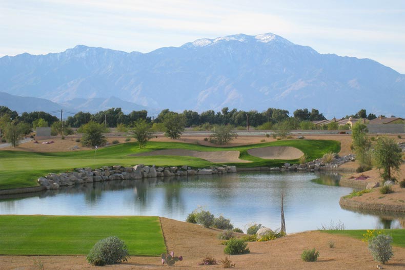 The golf course at Sun City Shadow Hills in Indio, California with a view of the mountains