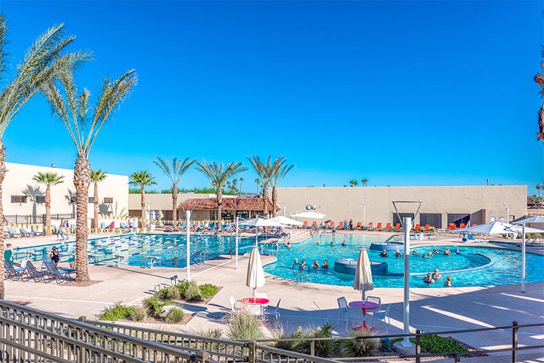 Residents enjoying the outdoor, resort-style pool at Sun City West in Arizona