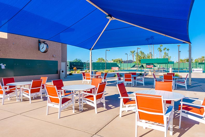 Tables and chairs on an outdoor patio at Sun City West in Arizona