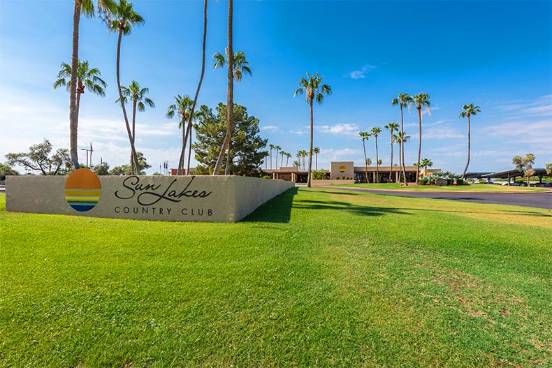 Palm trees near the community sign for Sun Lakes Country Club in Banning, California