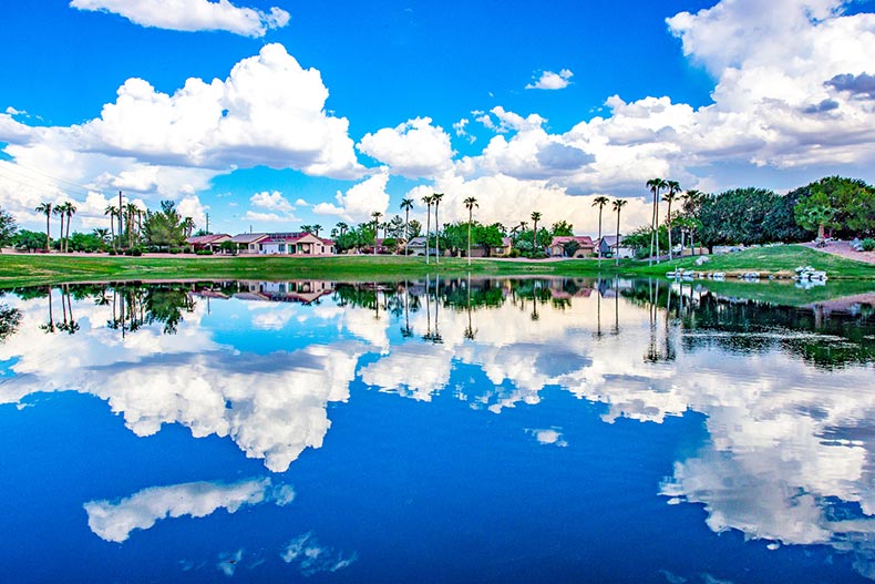 Clouds reflected on the surface of a calm pond on the grounds of Sun Lakes in Arizona