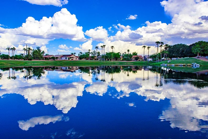  Photo of clouds reflecting in a lake on a golf course in the Sun Lakes active adult community of Sun Lakes, Arizona