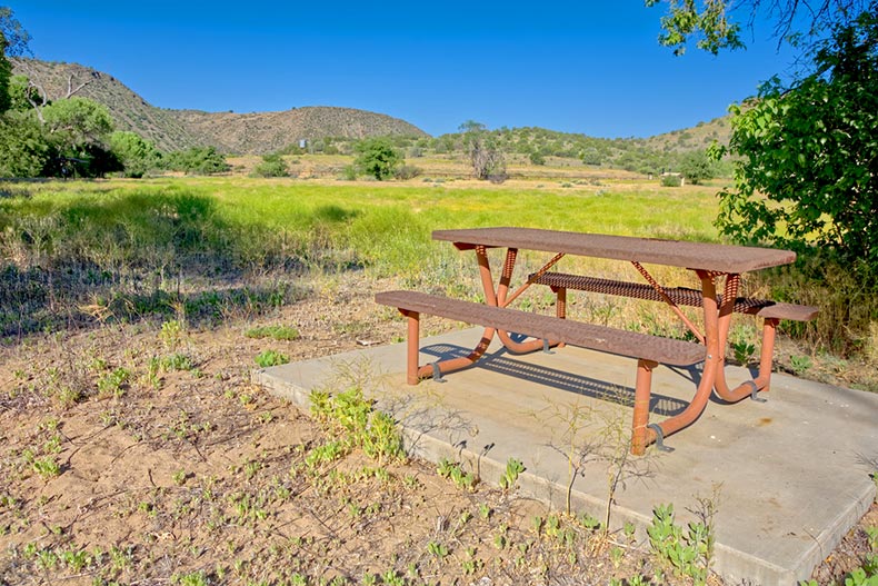 A picnic table at Stewart Ranch in the Upper Verde River Wildlife Area near Paulden, Arizona
