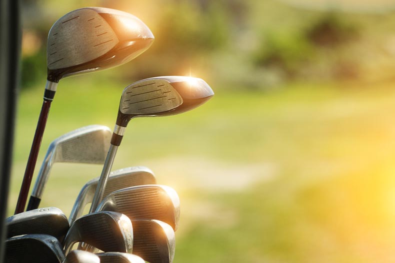 Sun shining on the heads of golf clubs at a golf course in Las Vegas