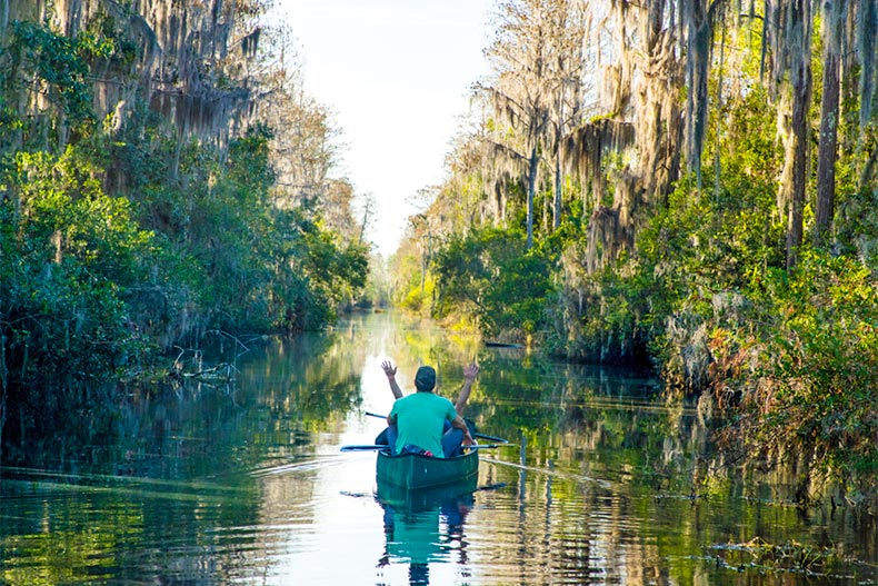 People in a canoe paddling down a river in Florida