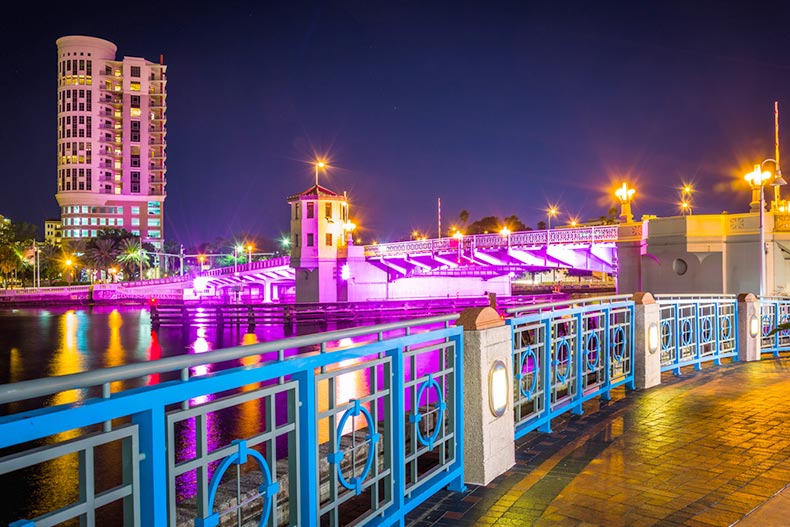 The Riverwalk and bridge over the Hillsborough River at night in Tampa, Florida