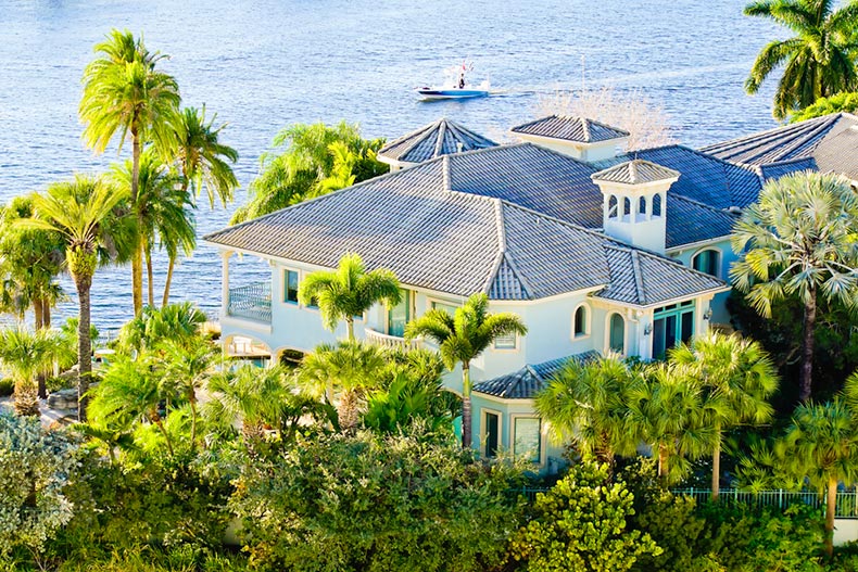 A waterfront house surrounded by palm trees in Tampa, Florida