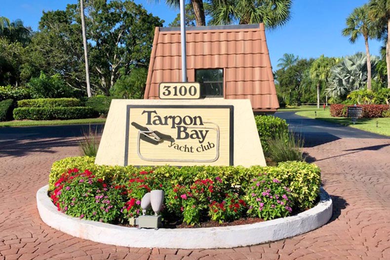 Flowers surrounding the community sign for Tarpon Bay Yacht Club in Port St Lucie, Florida