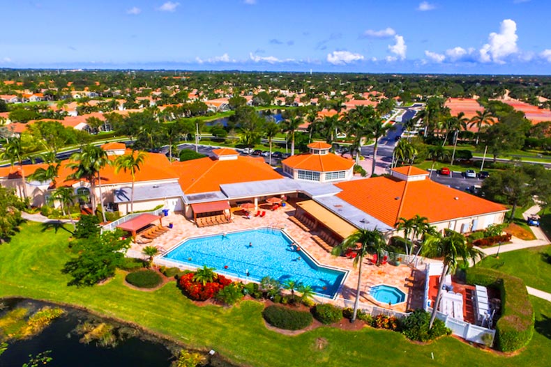 Aerial photo of The Grove 55+ community in Boynton Beach Florida, with the amenity center and pool area in the foreground