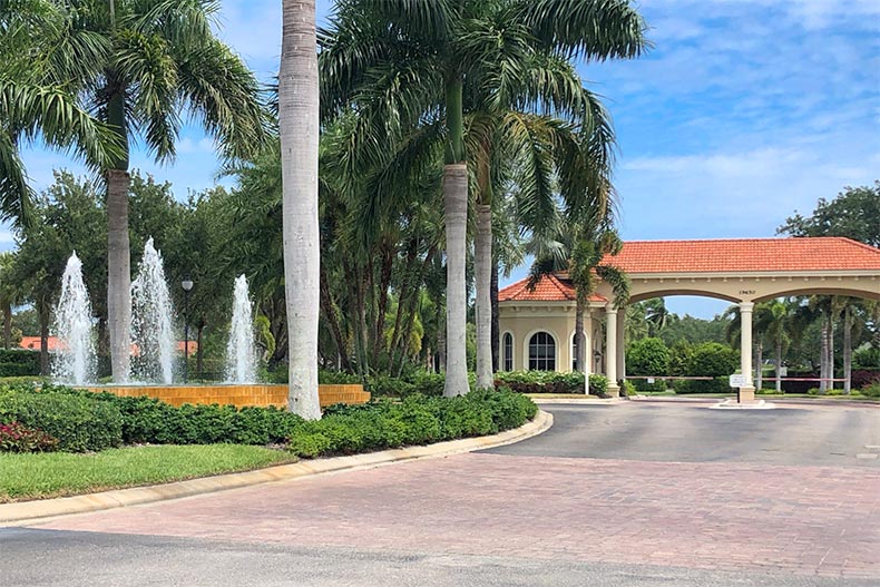 Palm trees and a fountain beside the entrance to The Reserve at Estero in Fort Myers, Florida