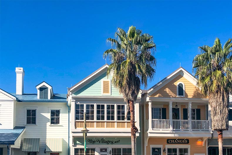 Palm tress outside storefronts at The Villages in Florida