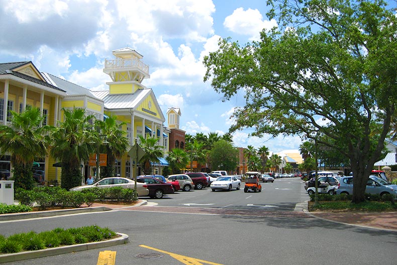 Palm trees and cars along a street in The Villages in Florida