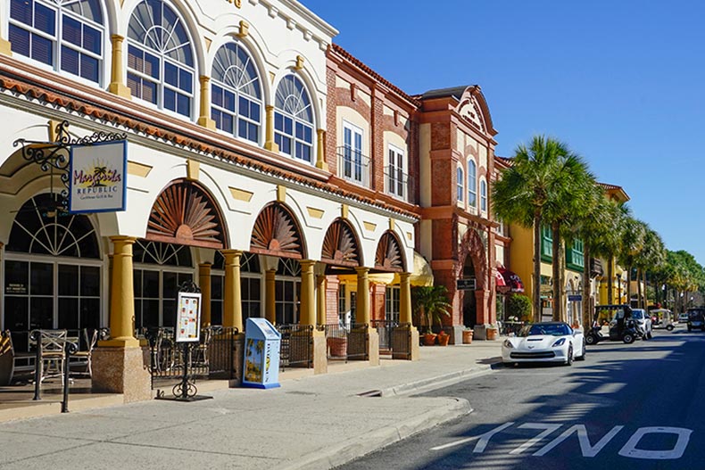 Palm trees and shops lining a street in The Villages, Florida