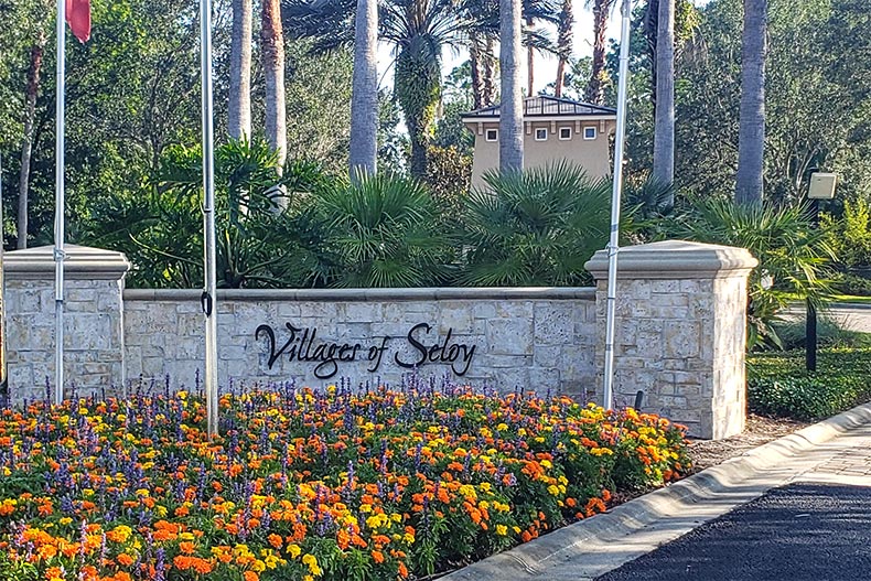 Flowers in front of the community sign for Villages of Seloy in Saint Augustine, Florida