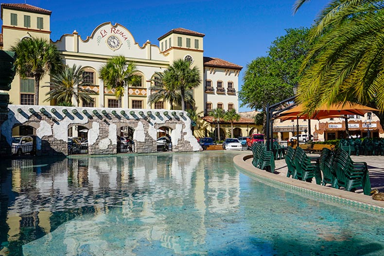 Palm trees and a water feature in a town square in The Villages, Florida