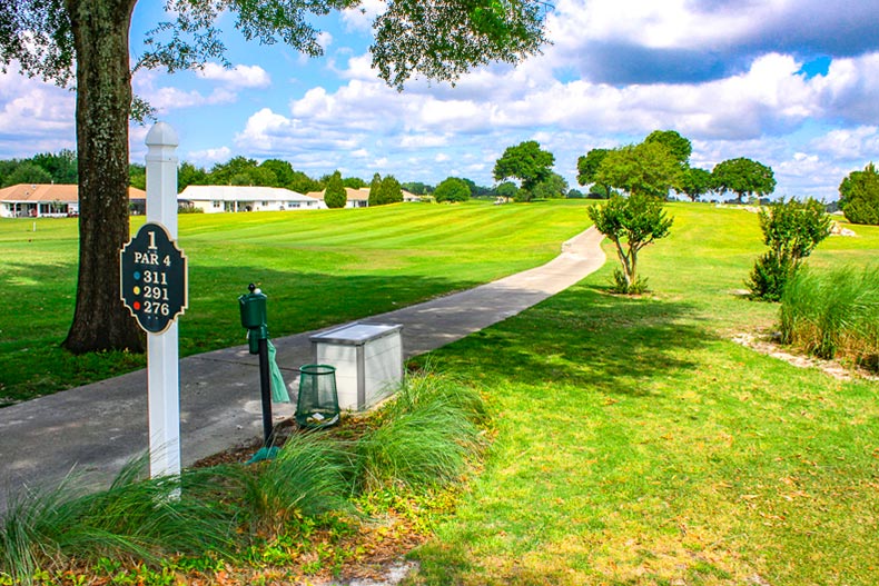 A pathway through a golf course at On Top of the World in Ocala, Florida