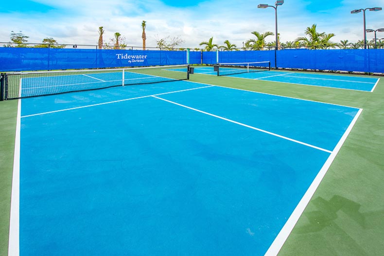 The outdoor tennis courts at Tidewater by Del Webb in Estero, Florida