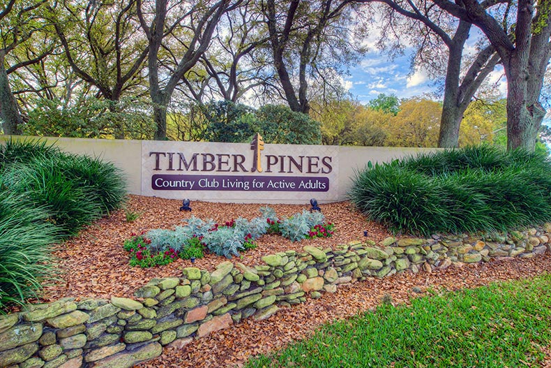 Greenery surrounding the community sign for Timber Pines in Spring Hill, Florida