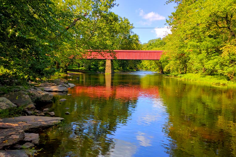 Red covered bridge over Tohickon Creek in Bucks County, Pennsylvania