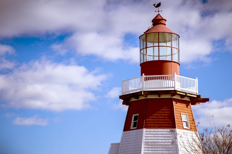 The top of a red and white lighthouse in Toms River, New Jersey