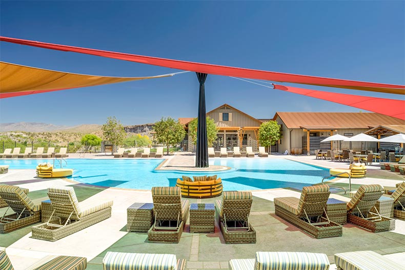 Lounge chairs beside the resort-style pool at Trilogy at Wickenburg Ranch in Wickenburg, Arizona