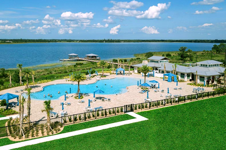 Aerial view of the amenity complex at Twin Lakes in St. Cloud, Florida, with a clubhouse, pool, and lake