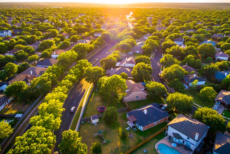 Aerial view of suburban homes west of Round Rock, Texas at sunset