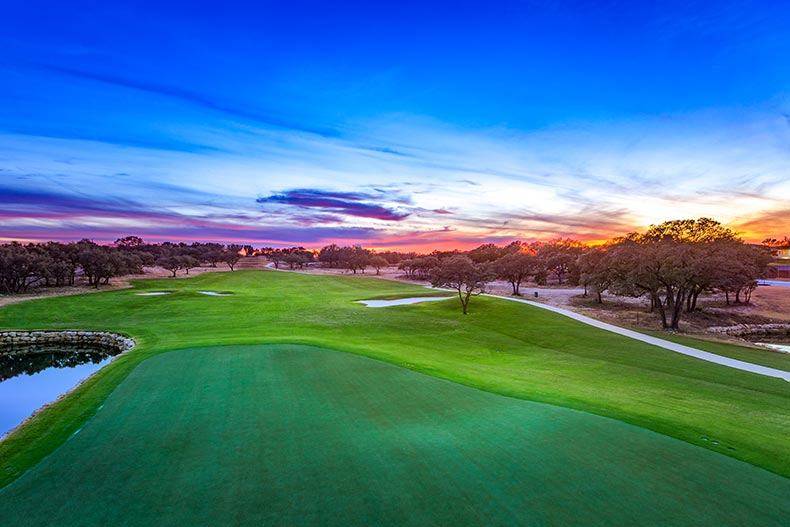 Sunset view of the golf course at Kissing Tree in San Marcos, Texas