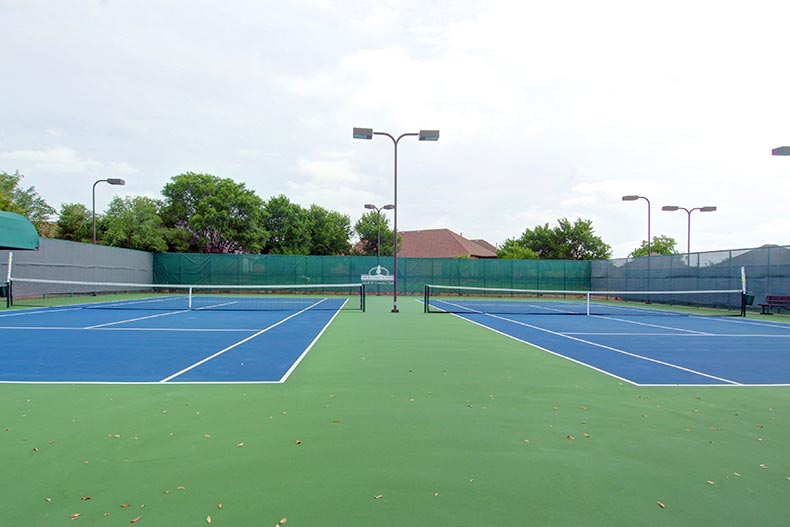View of the outdoor tennis courts at Heritage Ranch in Fairview, Texas