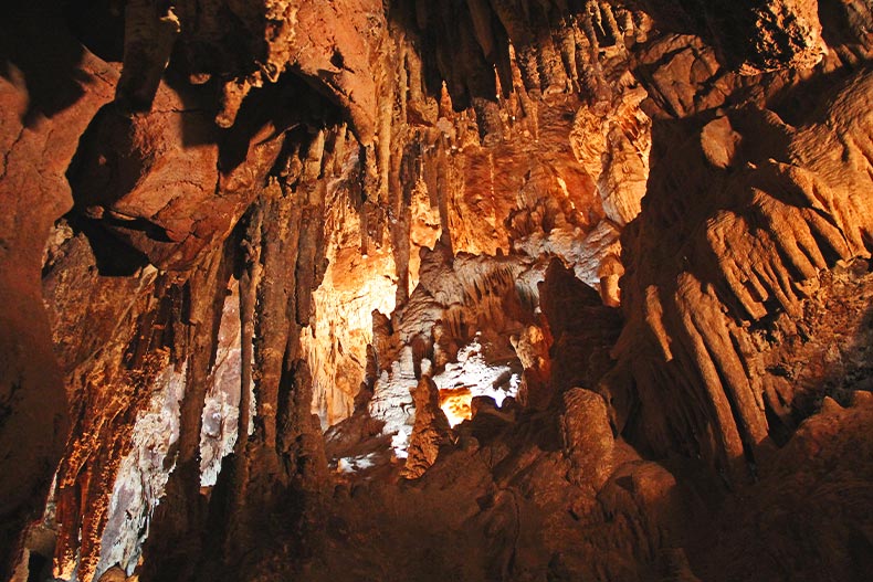 Photo taken inside Colossal Cave Mountain Park in Vail, Arizona showing rock formations from below