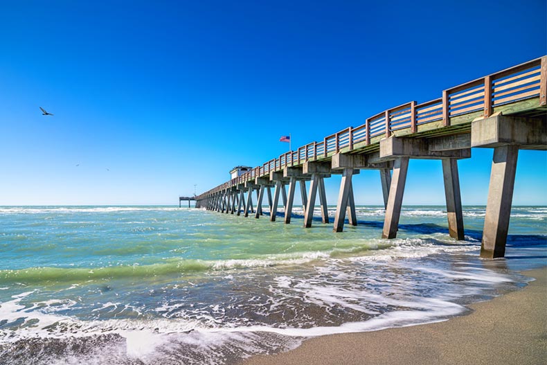 The pier in Venice, Florida extending into the ocean on a sunny day