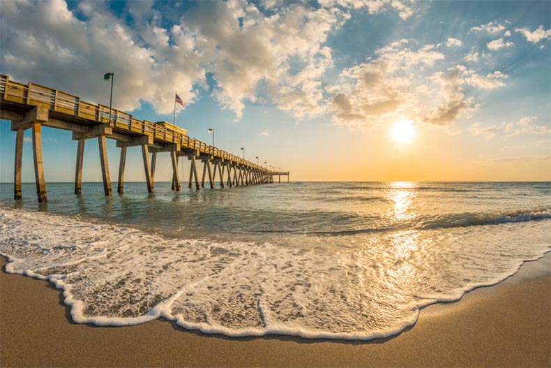 A sunset over the Gulf of Mexico and Venice Pier in Venice, Florida