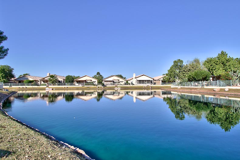 Homes surrounding a pond at Ventana Lakes in Peoria, Arizona