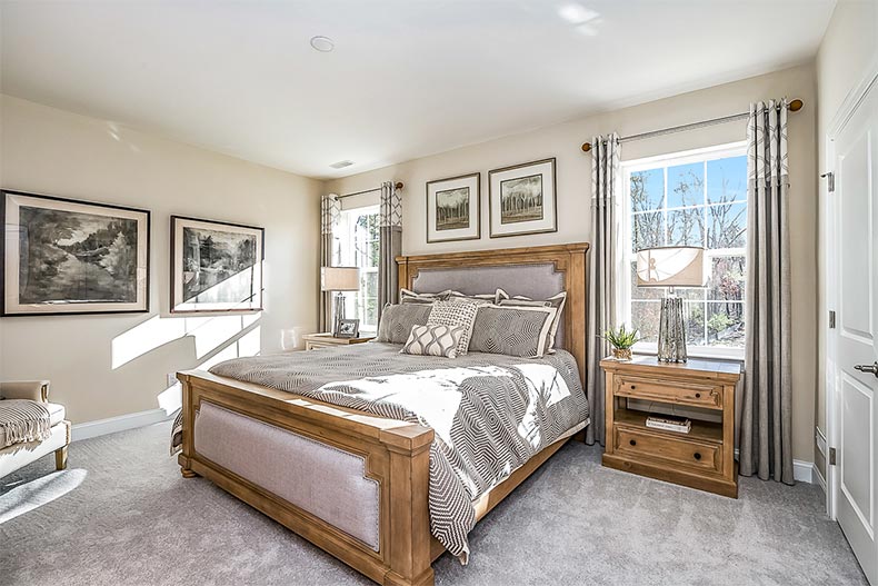 Interior view of a bedroom in a model home at Venue at Smithville Greene in Eastampton, New Jersey