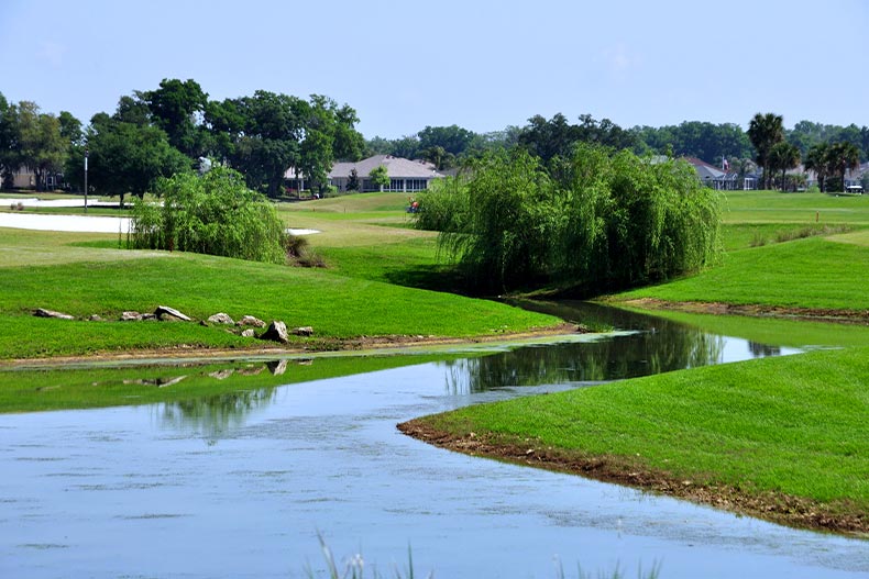 View of a pond running through a golf course in The Villages, Florida