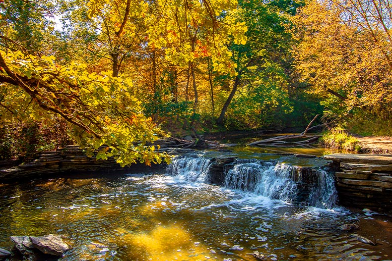 A short waterfall in the Waterfall Glen Forest Preserve during autumn in Illinois